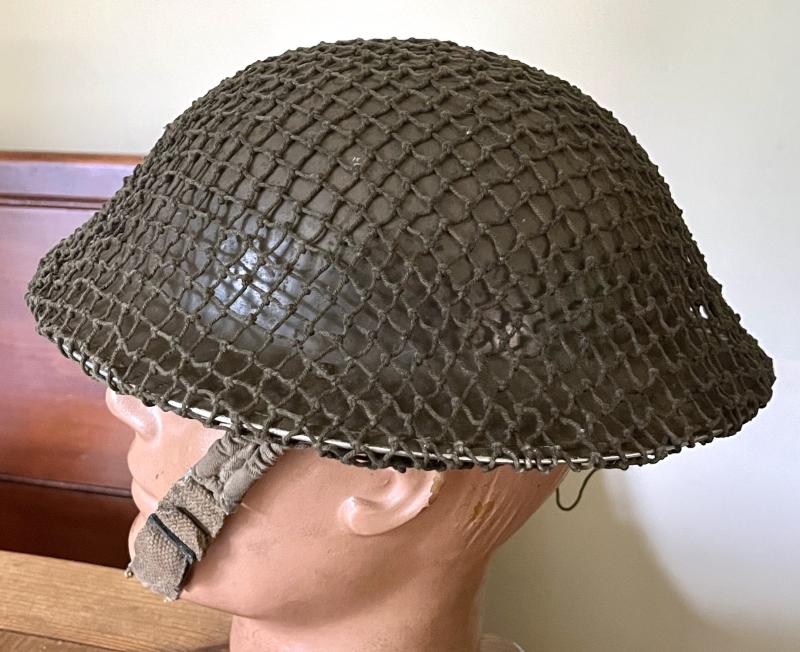 EARLY WW2 BRITISH TOMMY HELMET WITH NET & NAMED